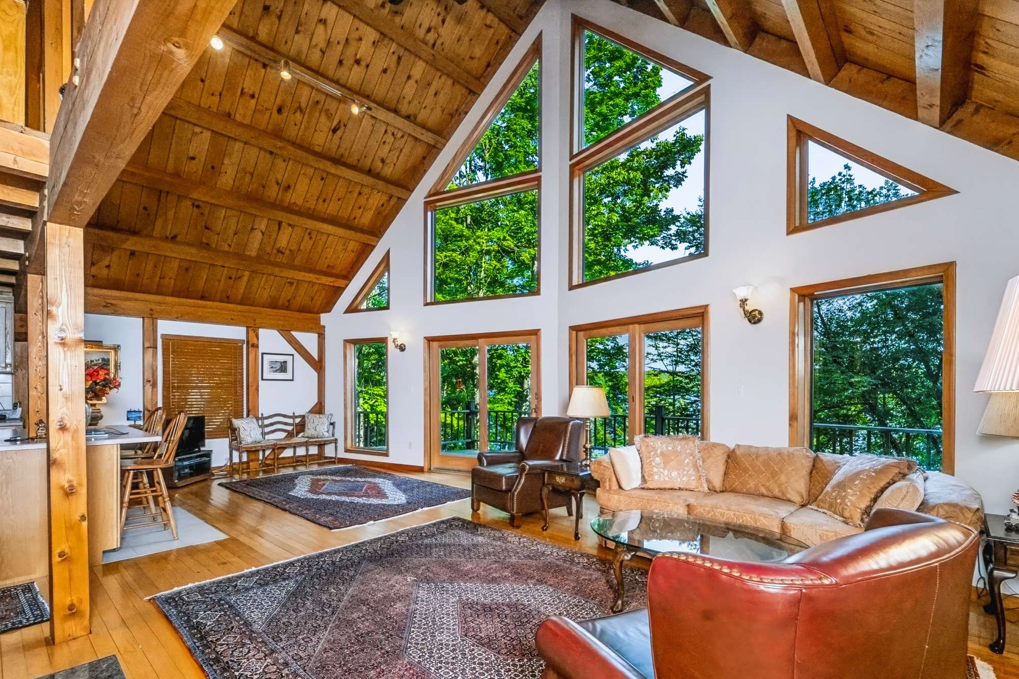 Vaulted great room with wall of windows, lakefront chalet — Capital Region NY real estate photography