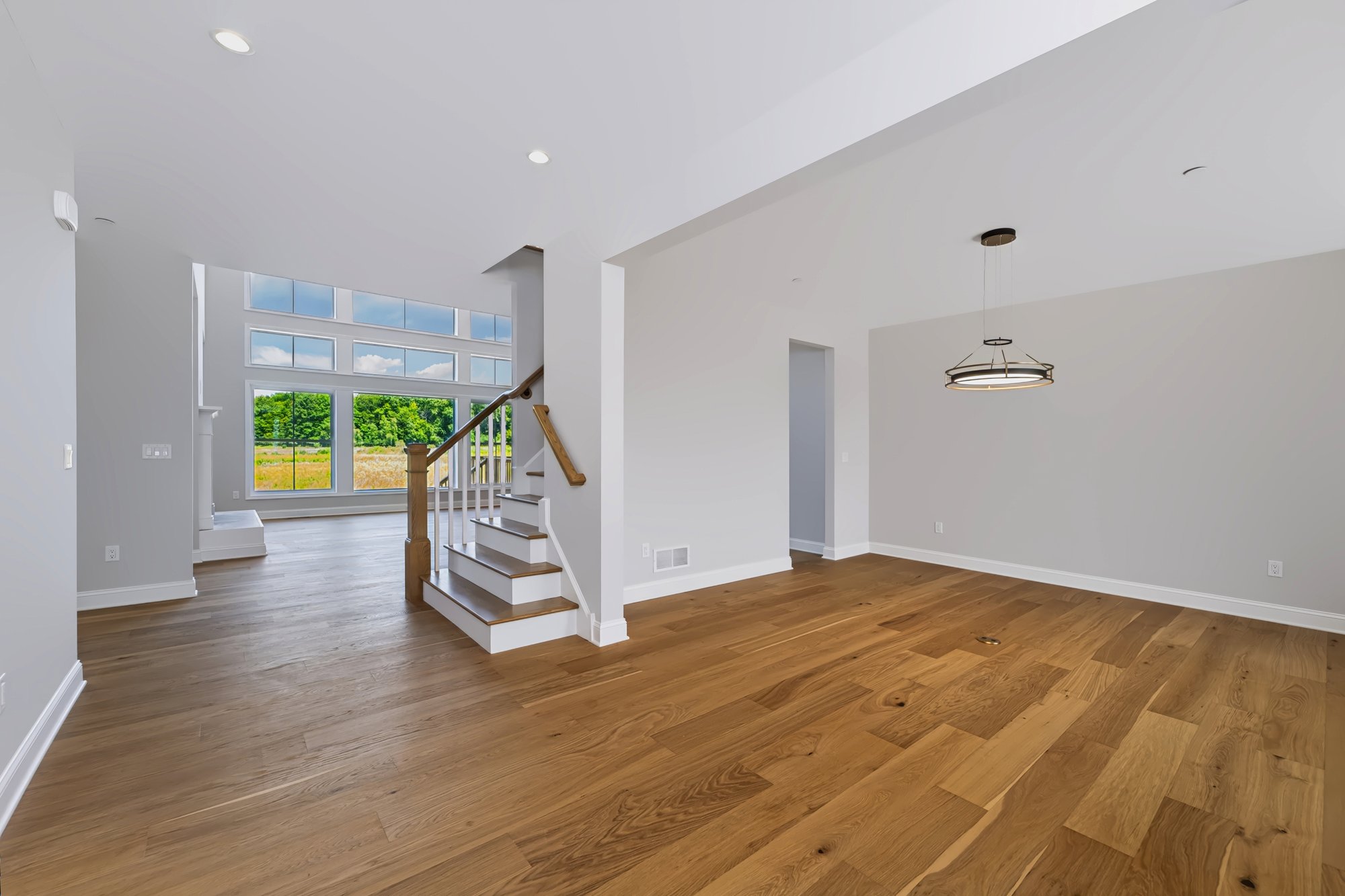 Bright entry foyer with staircase, new construction real estate photography — Capital Region NY