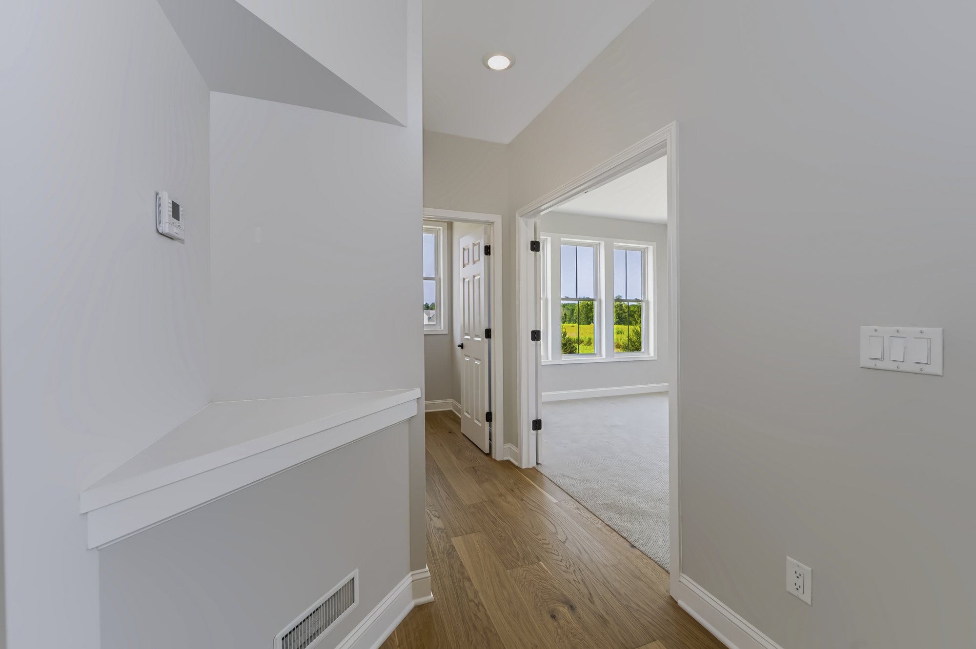 Vaulted hallway with hardwood floors — new construction real estate photography, Capital Region NY