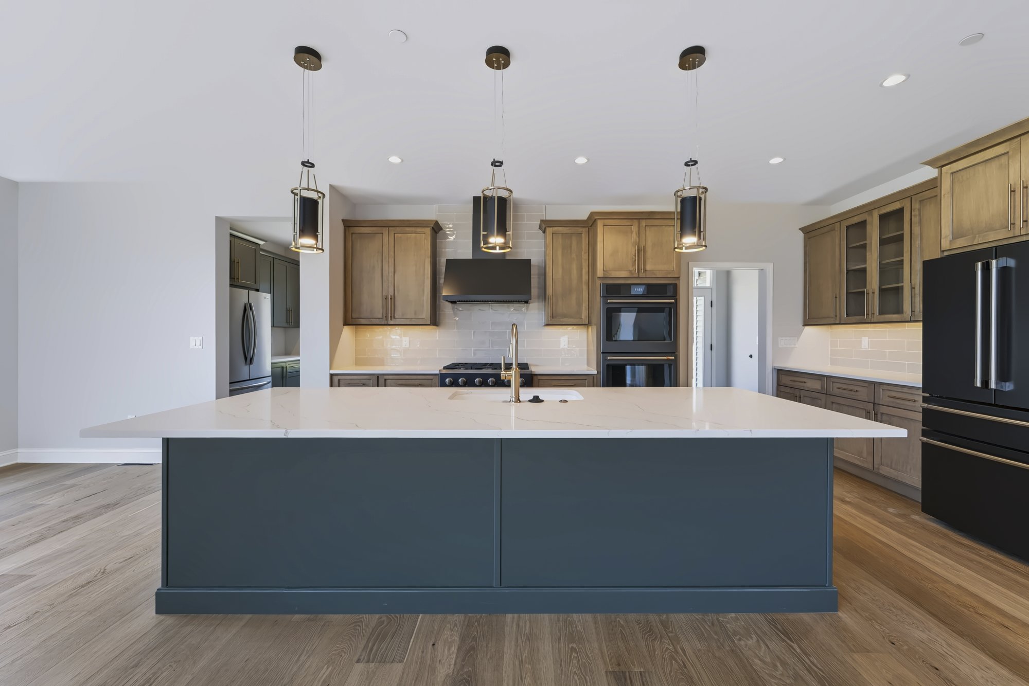 Modern kitchen with large island and stainless appliances — Capital Region NY real estate photography