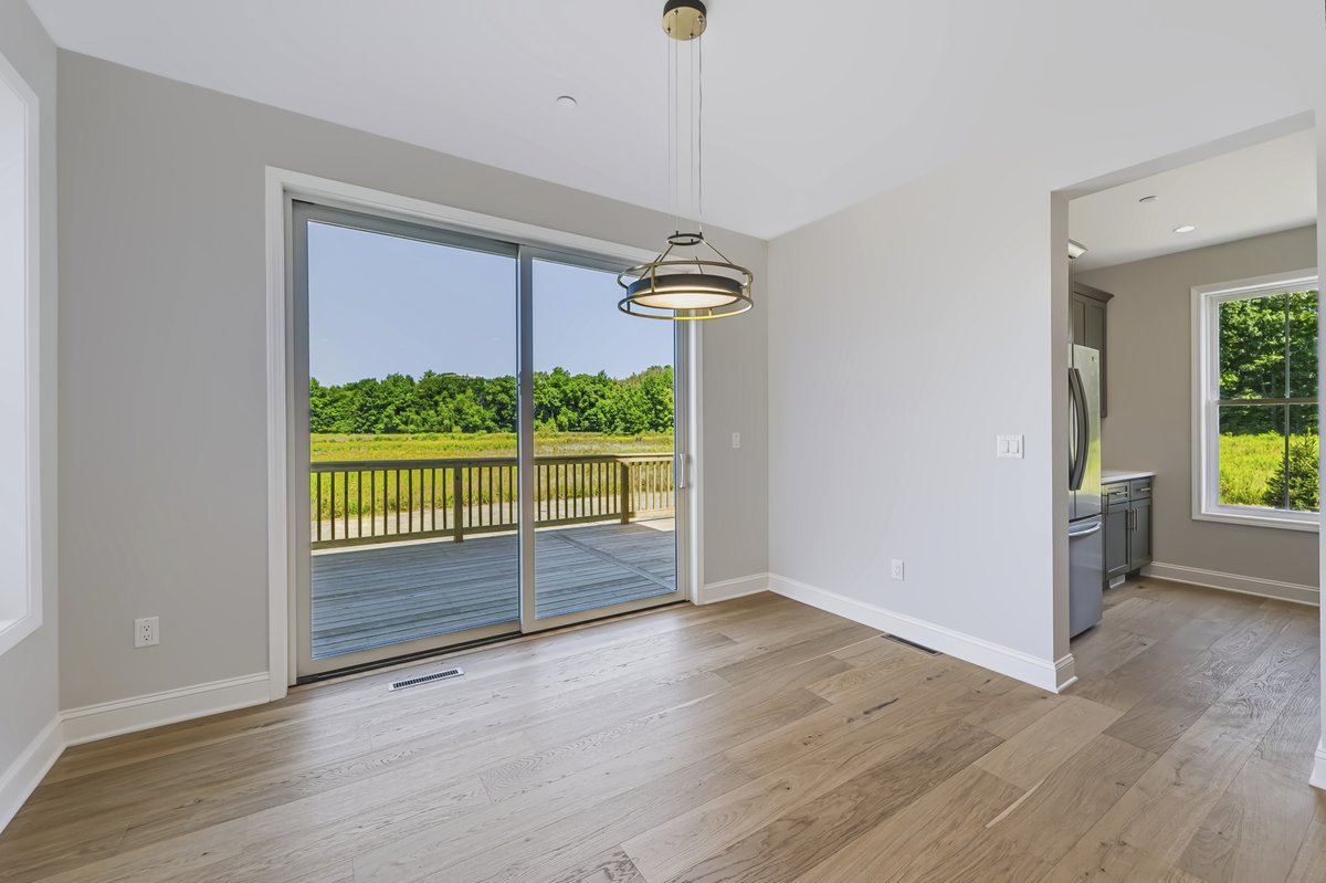 Kitchen cabinetry and open dining area flow — professional HDR real estate photography