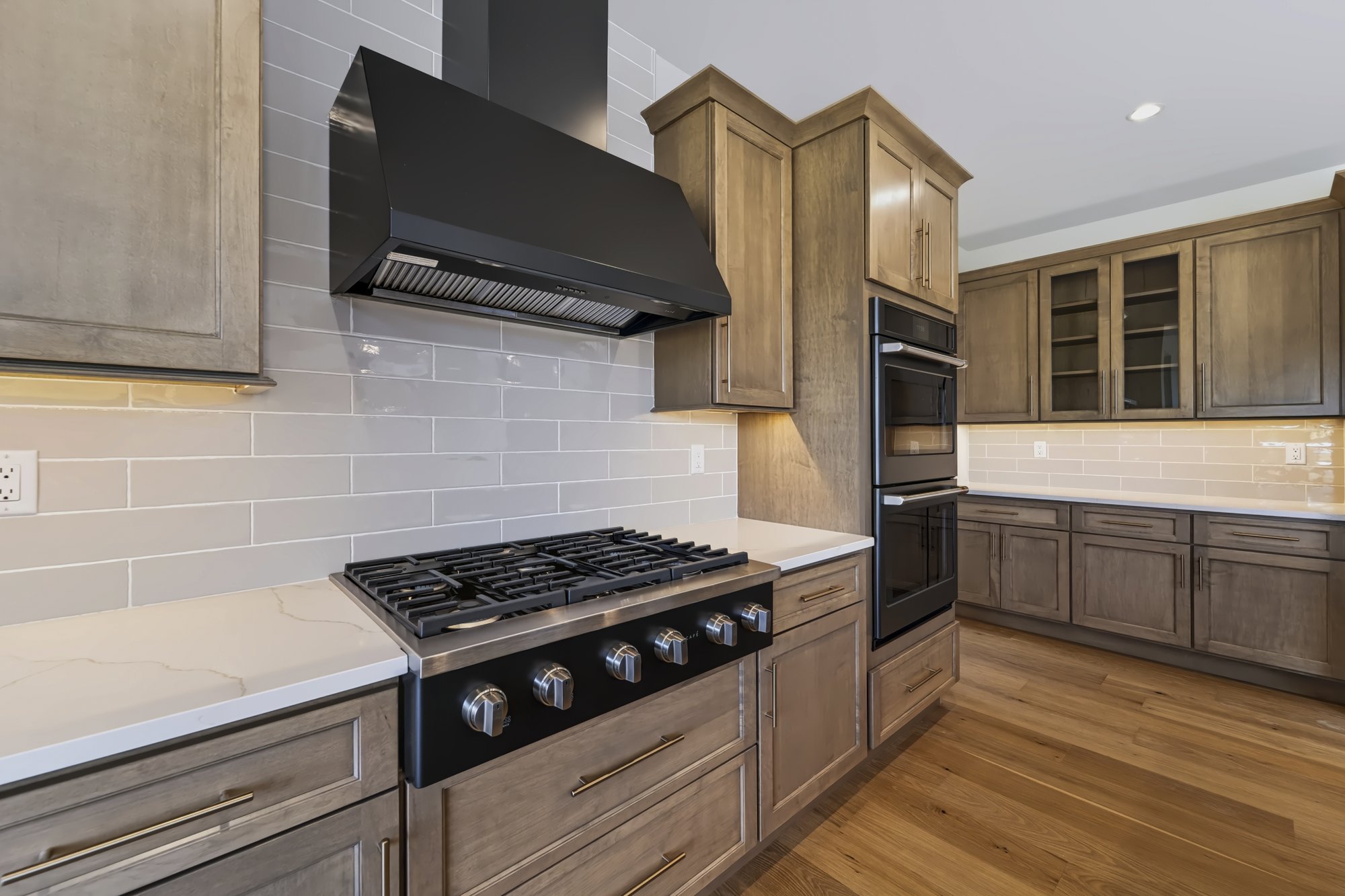 Kitchen detail with range hood and custom cabinetry — Capital Region NY real estate photography