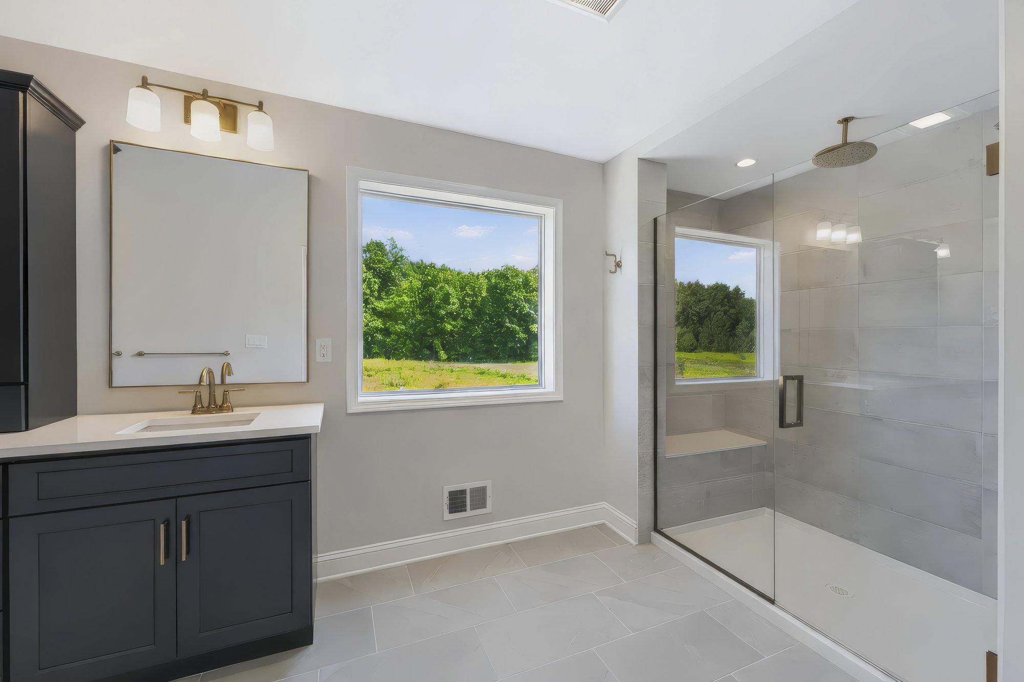 Primary bathroom with dual vanity and glass shower — HDR real estate photography, Capital Region NY