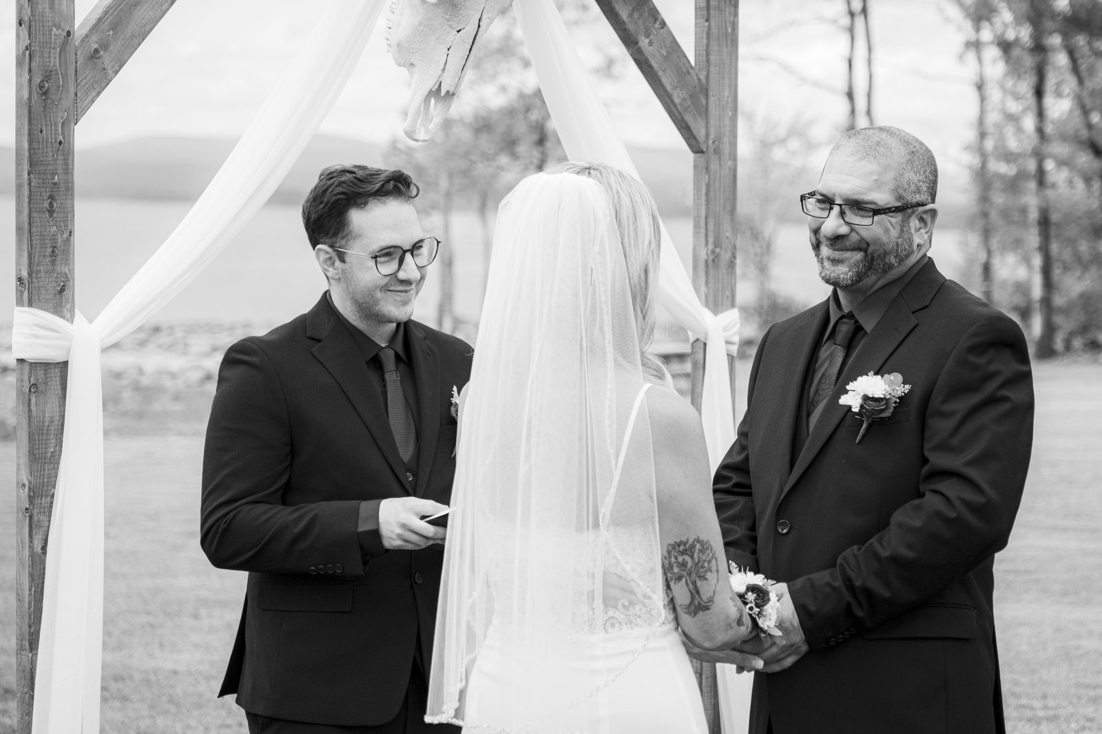 Couple during outdoor wedding ceremony at scenic upstate NY venue
