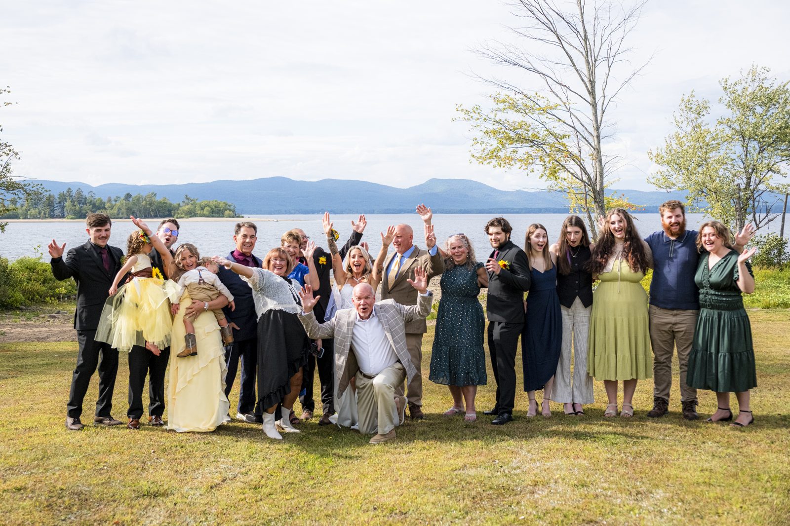 Newlyweds and wedding party group photo by the lake, Capital Region